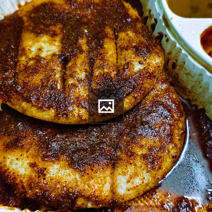 Two crispy Podi Idli with butter