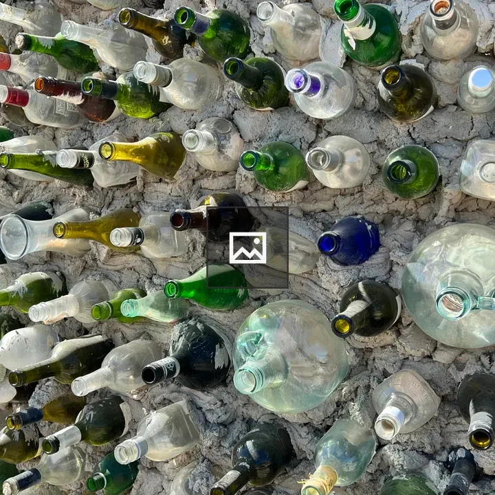 Glass bottles embedded in wall