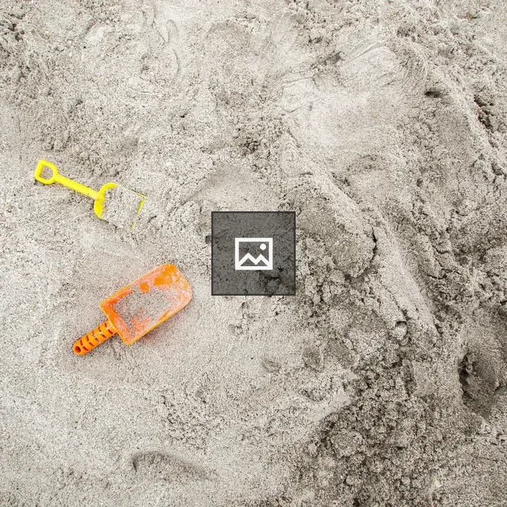 Shovels in the Sand at the Beach