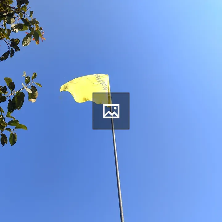 Yellow flag in blue sky