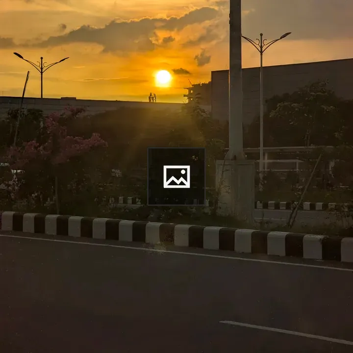 Sunset Over Building and Road