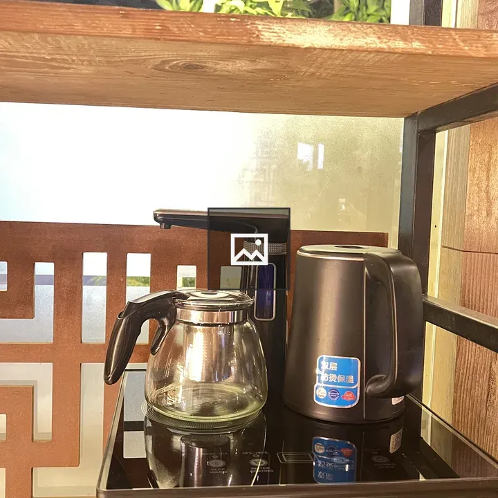 Water heater and kettle on table