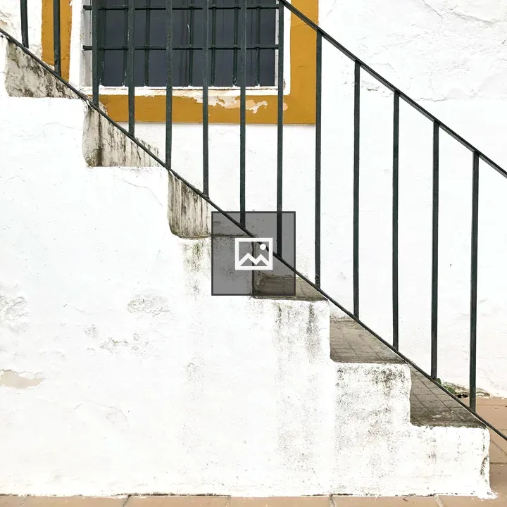 External staircase with green railing