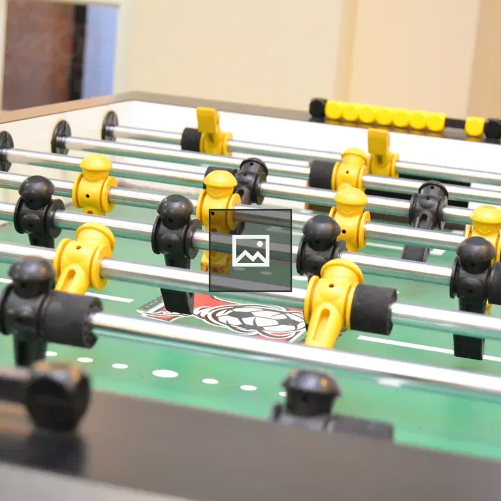 Foosball table with pegs