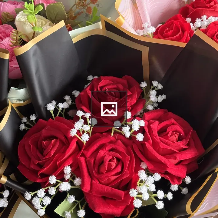 Bouquet of red roses wrapped in black and gold