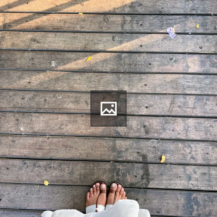 Feet in Brown Sandals on Deck
