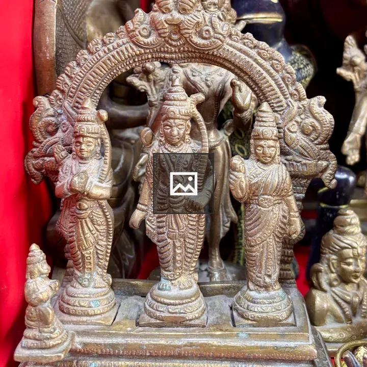 Statues against red background