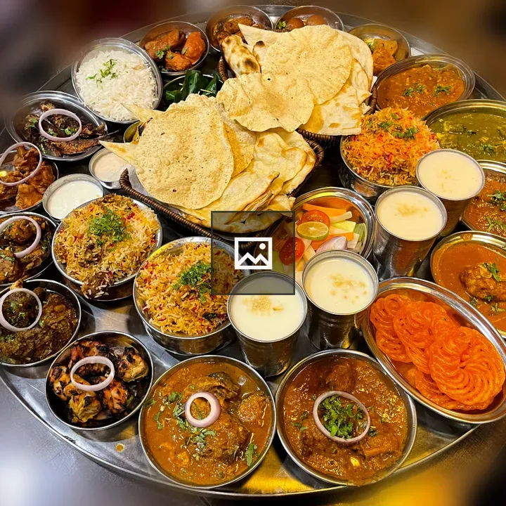 Indian cuisine spread with rice and biryani