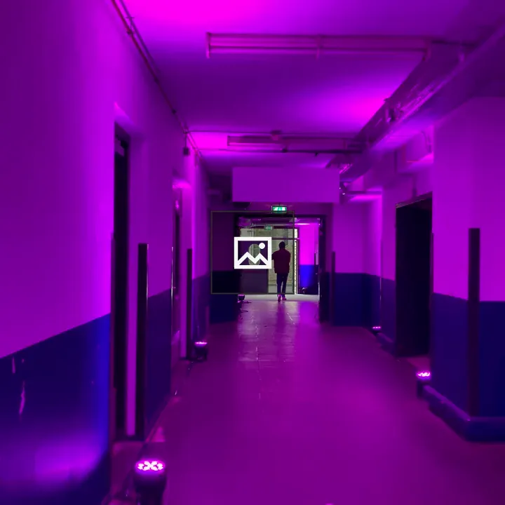 Industrial hallway with pink lights
