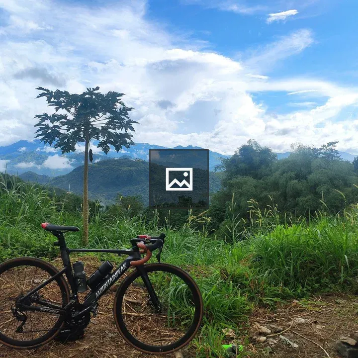 Bicycle on Dirt Path with Hills