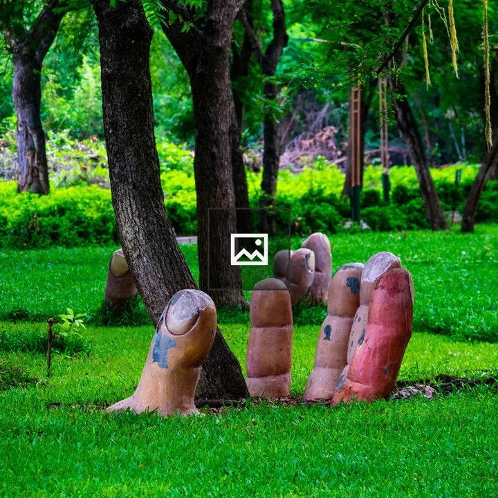 Giant fingers cradle a tree