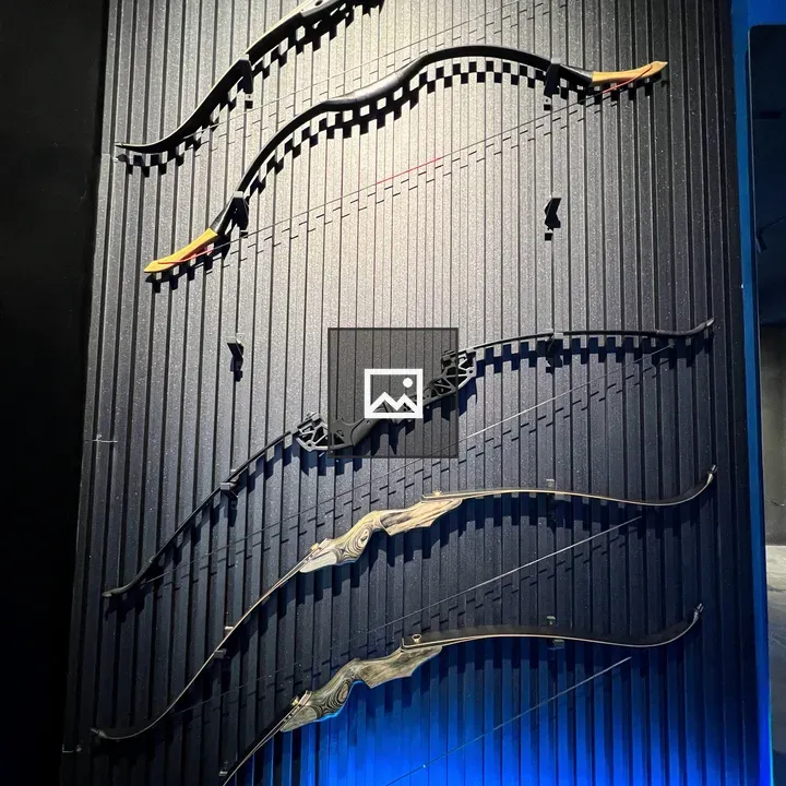 Five archery bows on wall