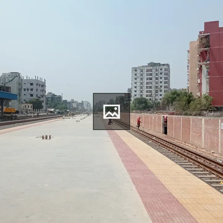 Railway station with blue-roofed building
