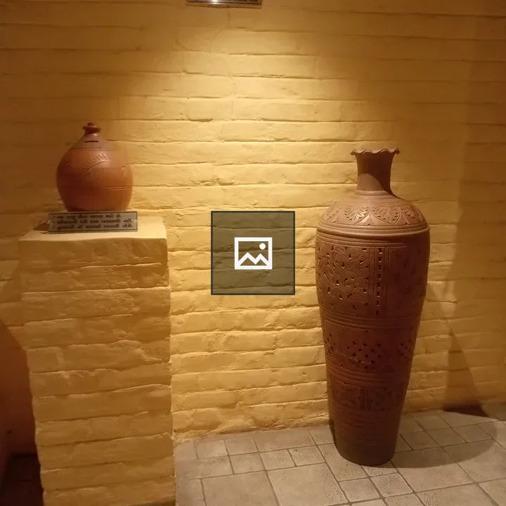 Terracotta Pots Against Brick Wall