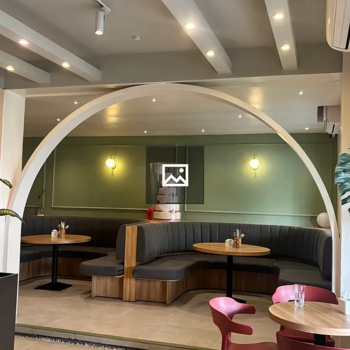 Modern café interior with green wall