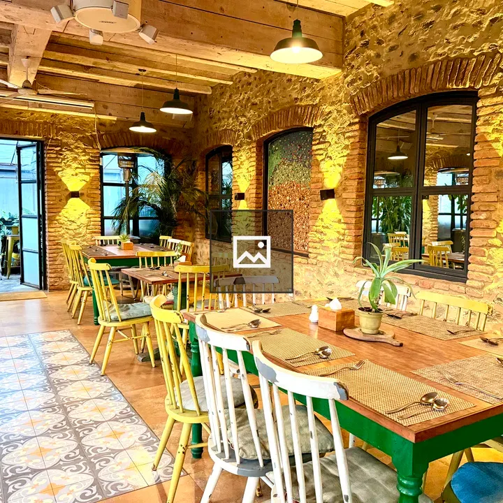 Cozy dining area with rustic walls