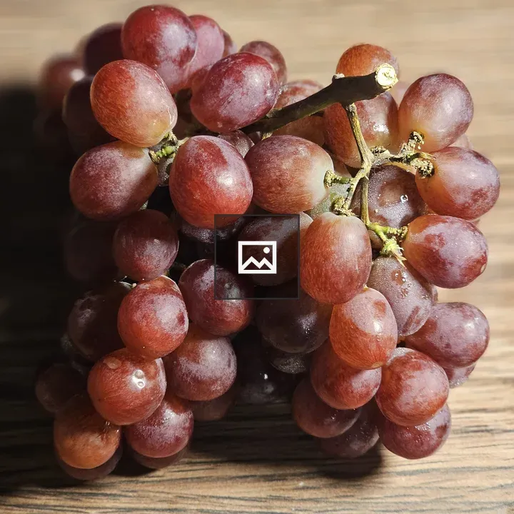 Red Grapes on Wooden Surface