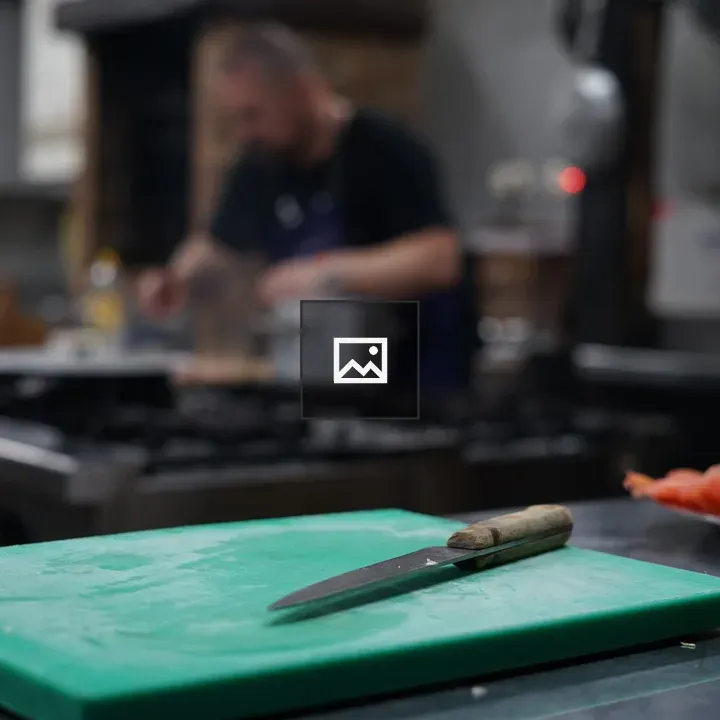 Kitchen knife on cutting board