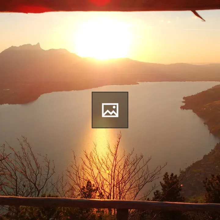Sunset over river and mountains