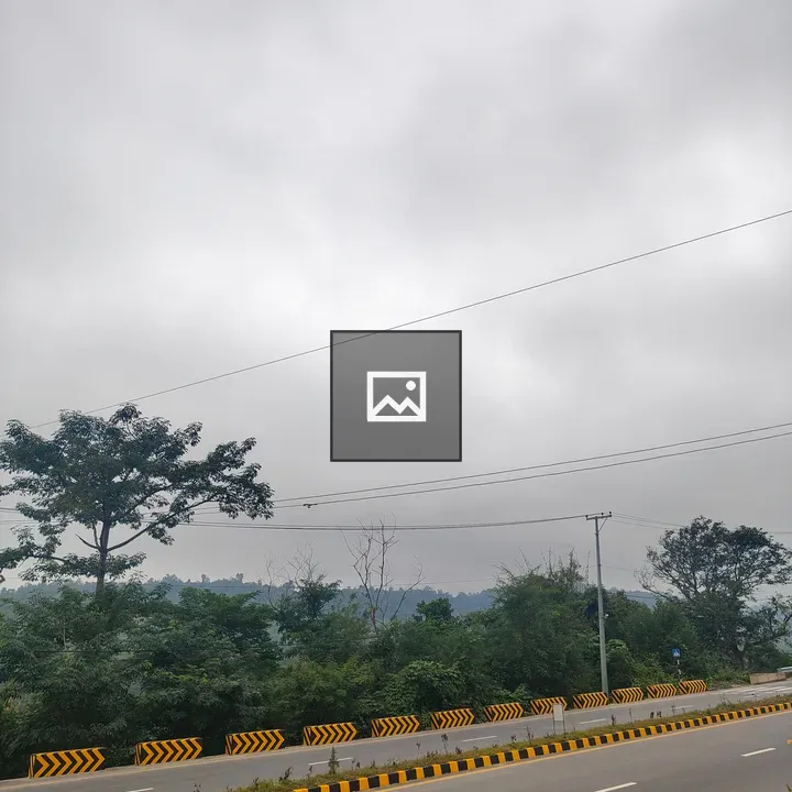 Cloudy sky over a roadside scene