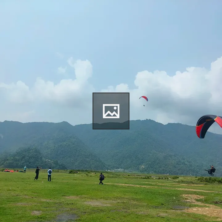 Parachutes over Green Meadow in Pokhara
