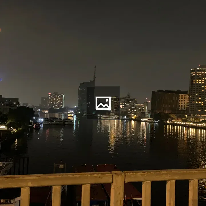 City lights on river at night