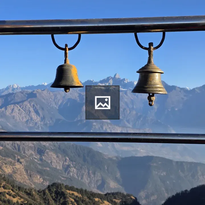 Two brass bells on bar
