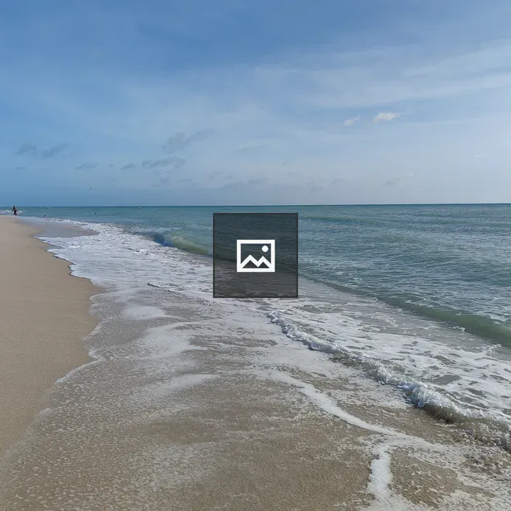 Beach scene with distant walker
