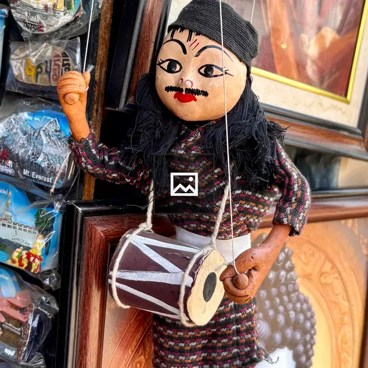 Colorful traditional puppet with drum