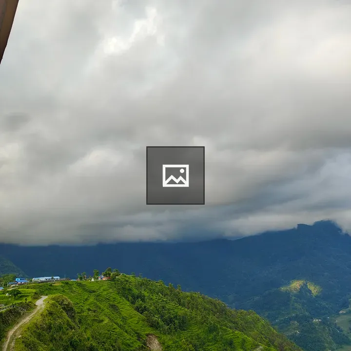 Panoramic hills under cloudy sky