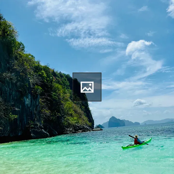 Kayaker on turquoise water