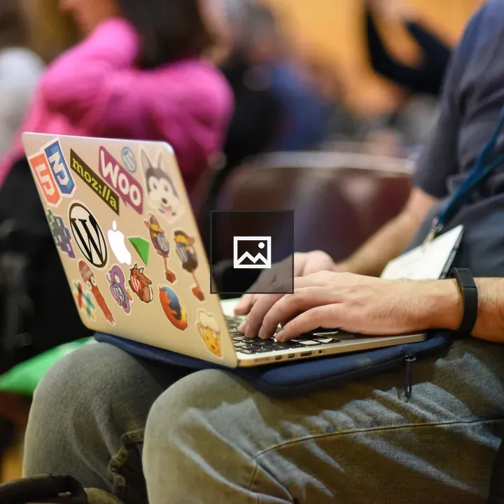 Person taking notes on a laptop
