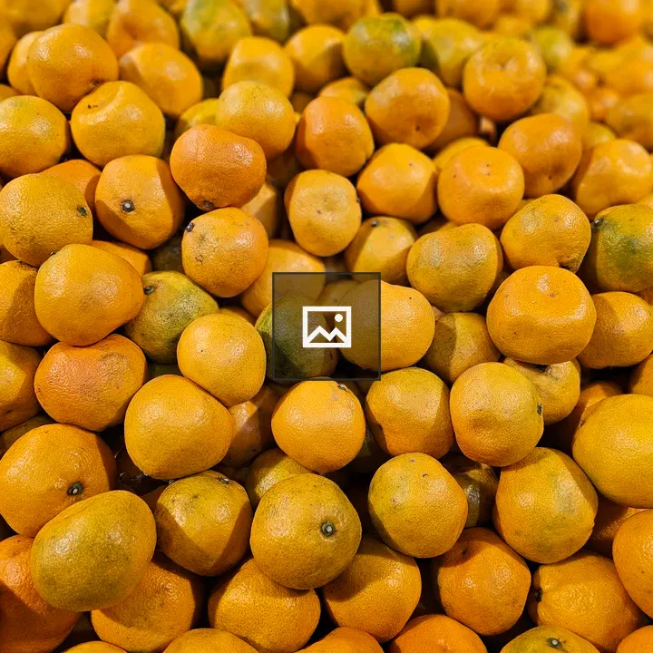 Piles of Oranges at Market