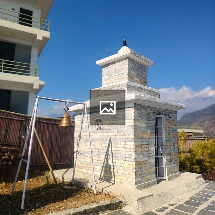 Stone shrine beside path