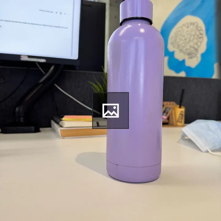 Purple water bottle on desk