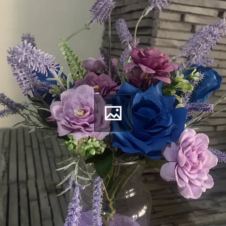 Artificial flower arrangement in vase
