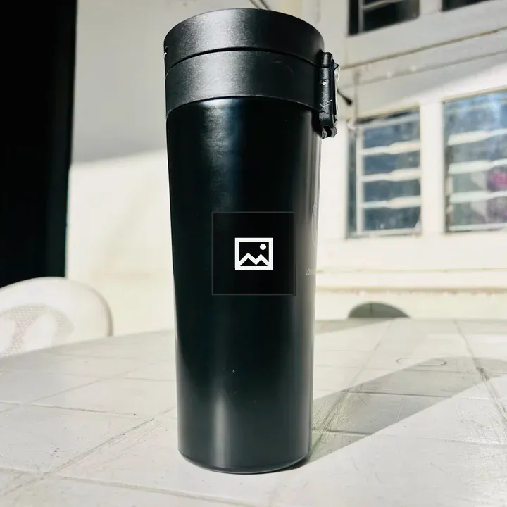 Black coffee mug on white table