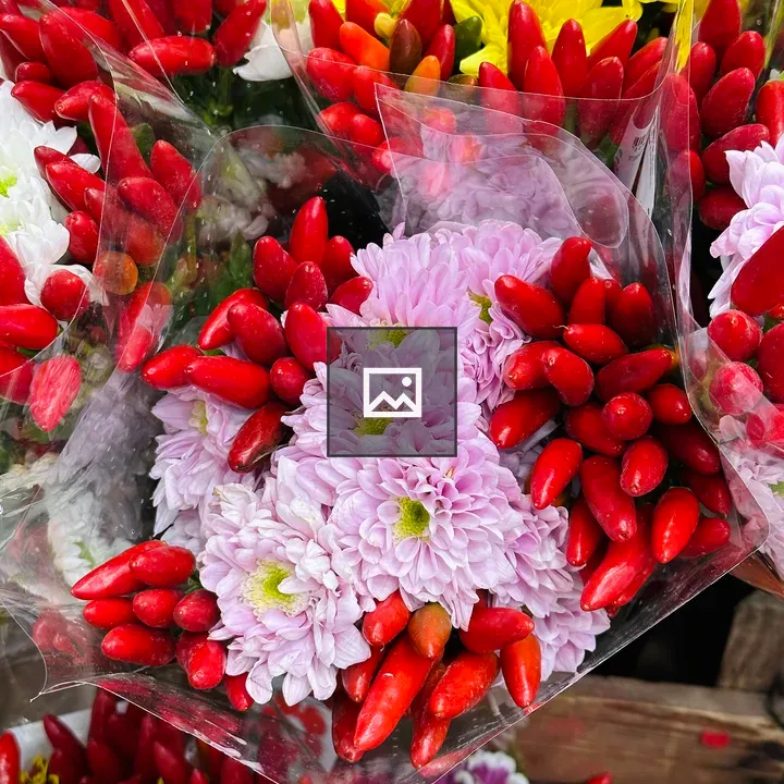 Colorful floral arrangement with peppers