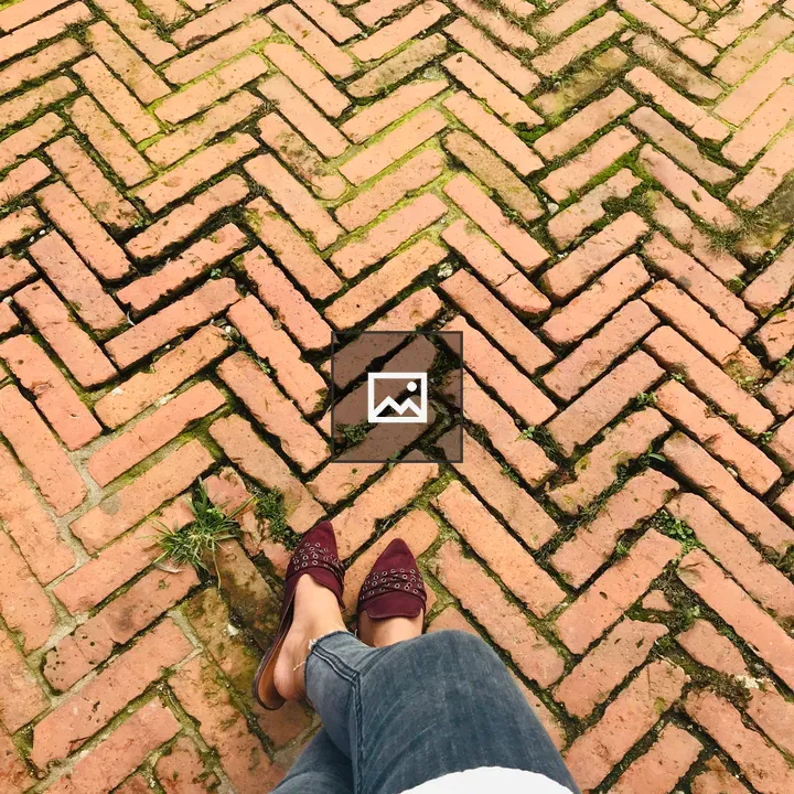 Legs and feet on brick path