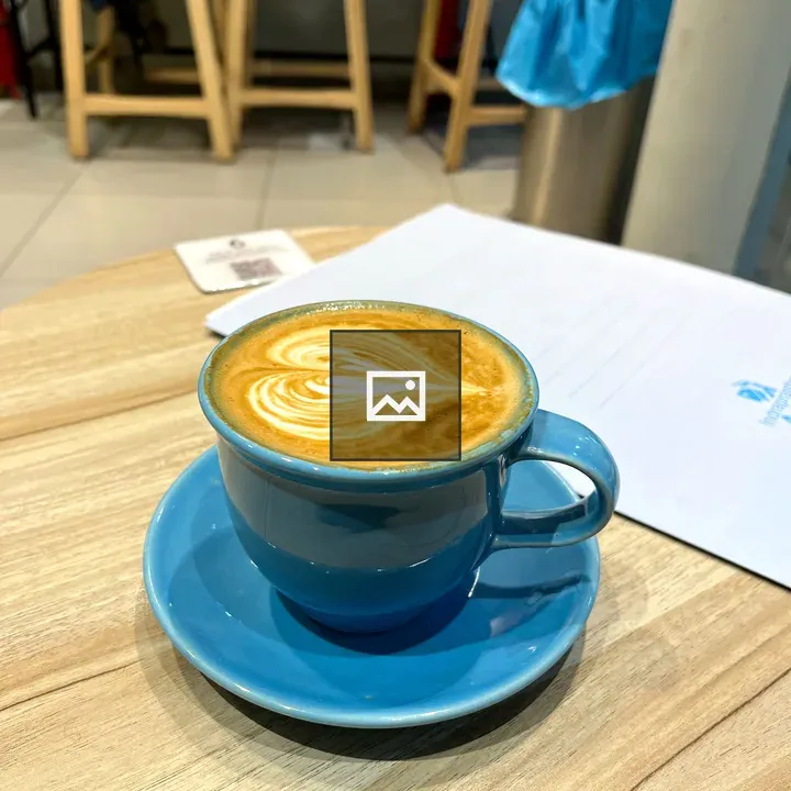Blue Latte Cup on Wooden Table