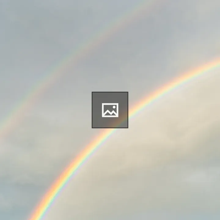 Double rainbow over blue sky