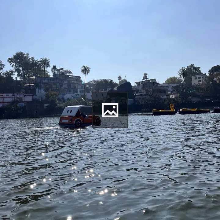 Car-shaped pedal boat on lake