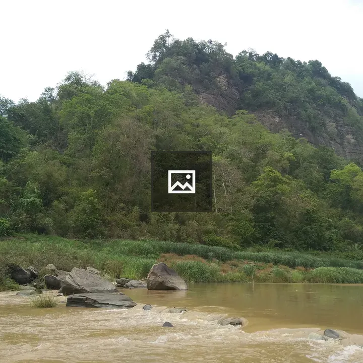 Serene river among rocks and trees