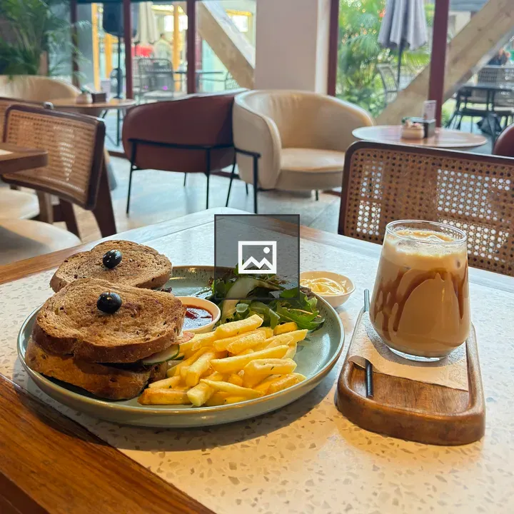 Plate with sandwich and coffee