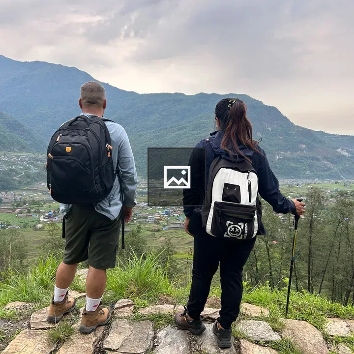 Two hikers on rocky outcrop