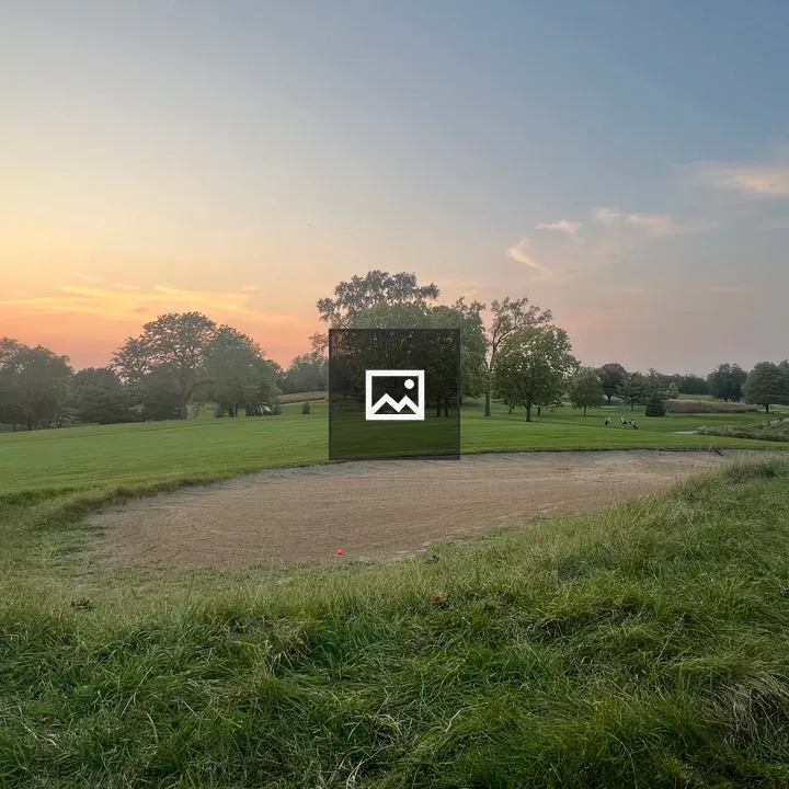 Pink golf ball in sand trap