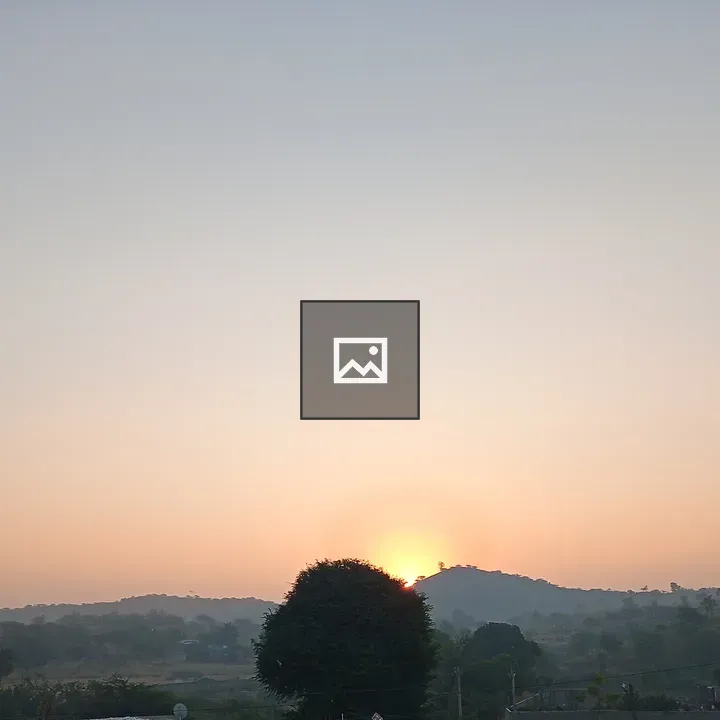 Sunset Behind Hills haze