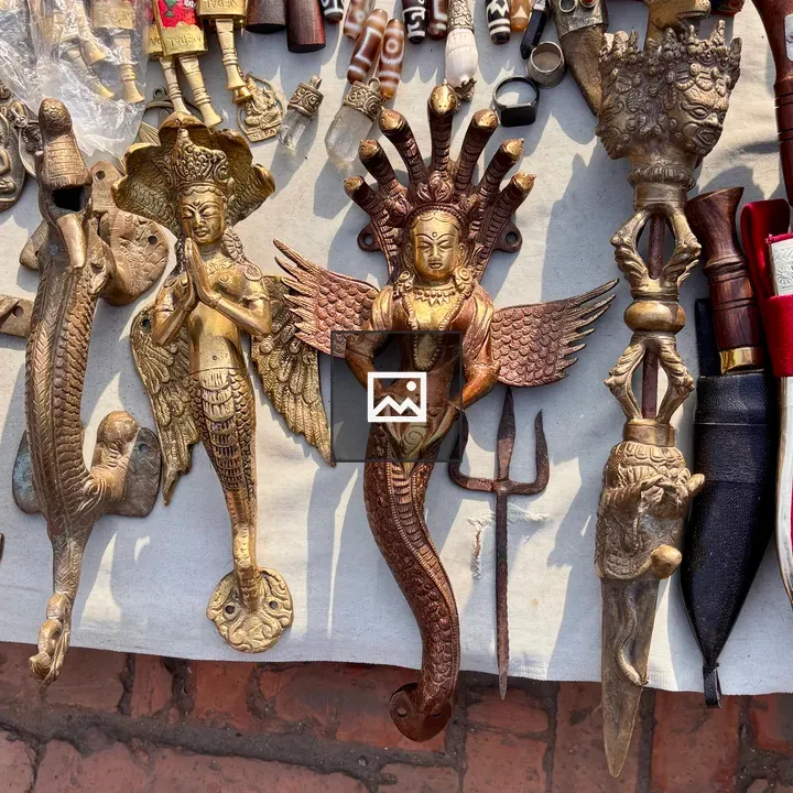 Carved metal and wood display