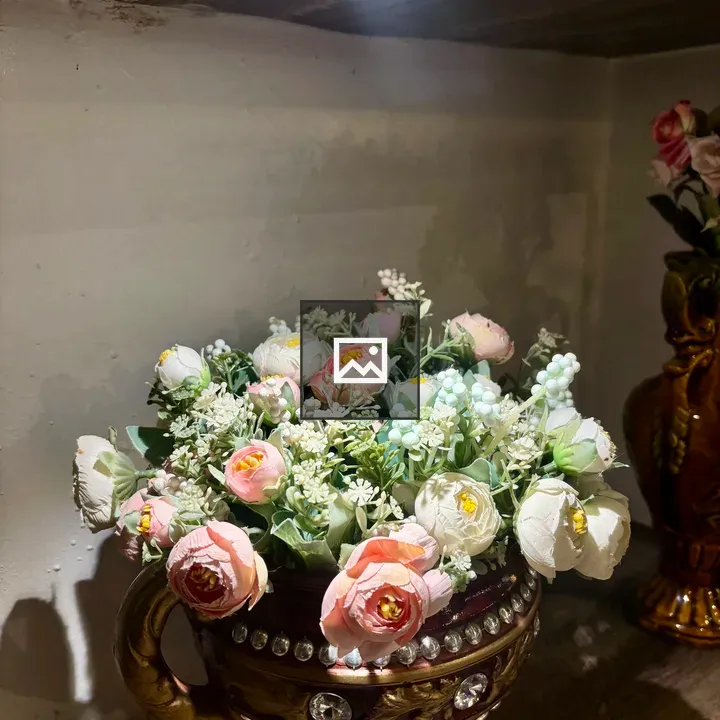 Decorative arrangement of artificial flowers