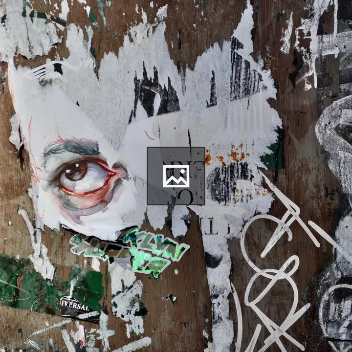 Griffiti and torn poster eye